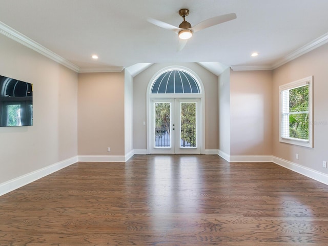 2509 N Dundee St, Tampa, FL 33629 - unfurnished room with dark wood-style flooring, healthy amount of natural light, crown molding, ceiling fan, and baseboards