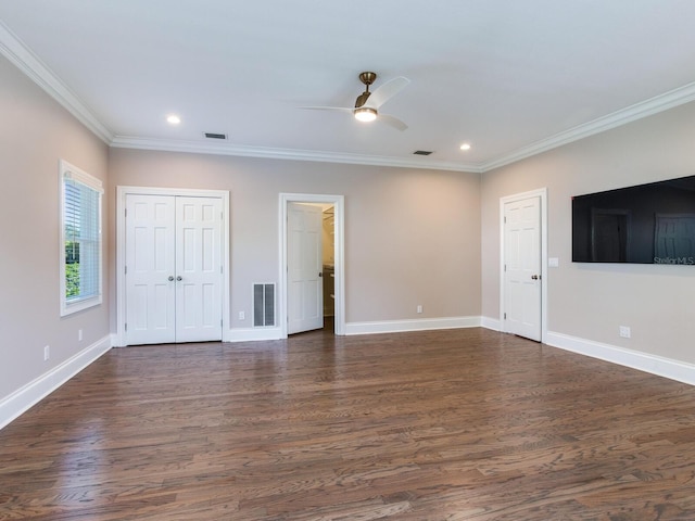 unfurnished living room with crown molding, dark wood-type flooring, and ceiling fan