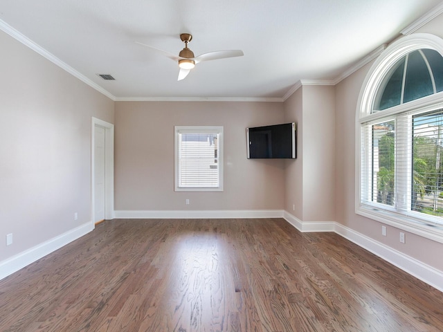 unfurnished room featuring crown molding, dark hardwood / wood-style flooring, and ceiling fan