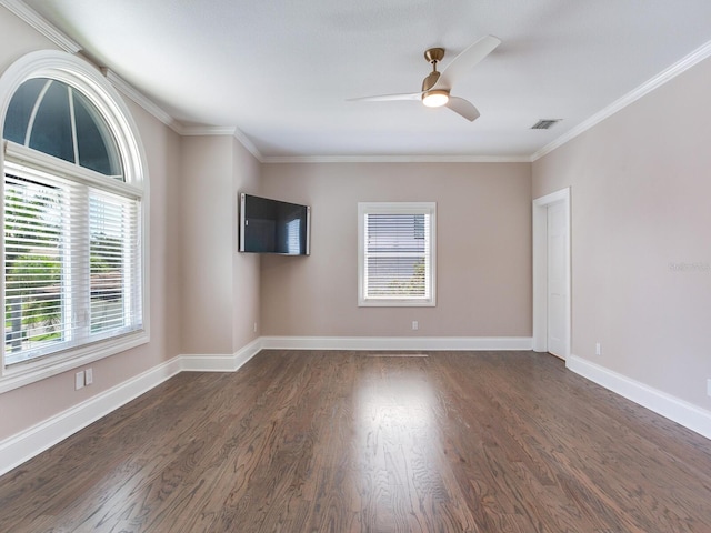 interior space with ornamental molding, ceiling fan, and dark hardwood / wood-style flooring