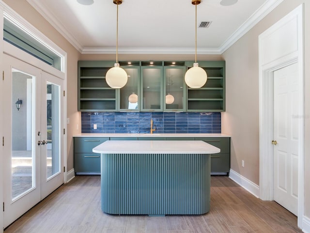 kitchen with french doors, pendant lighting, and light wood-type flooring