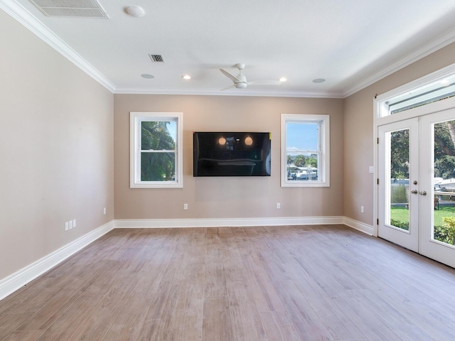 2509 N Dundee St, Tampa, FL 33629 - unfurnished living room featuring french doors, wood finished floors, ornamental molding, baseboards, and a ceiling fan