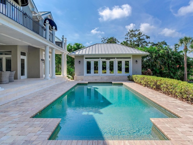 view of swimming pool with a patio