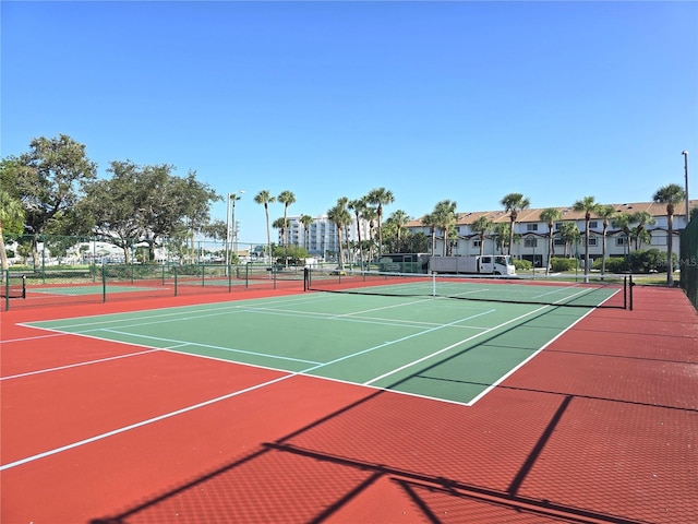 view of tennis court featuring basketball court