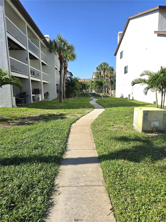 view of property's community with a yard