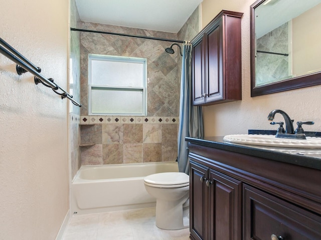 full bathroom featuring vanity, toilet, tile patterned floors, and tiled shower / bath