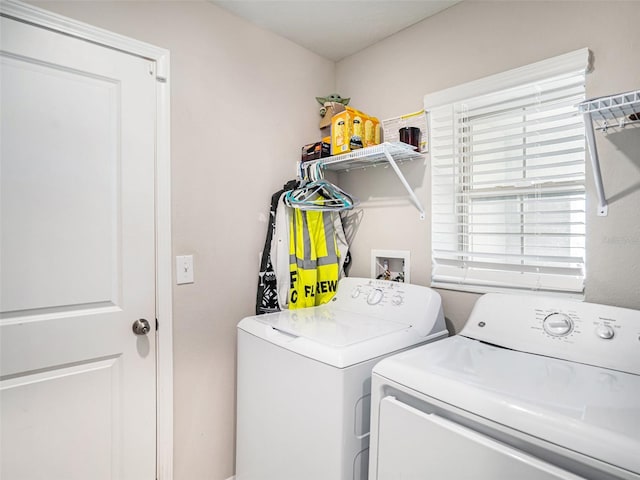 clothes washing area with washer and dryer