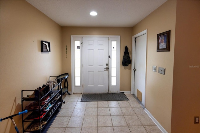 foyer with light tile patterned floors