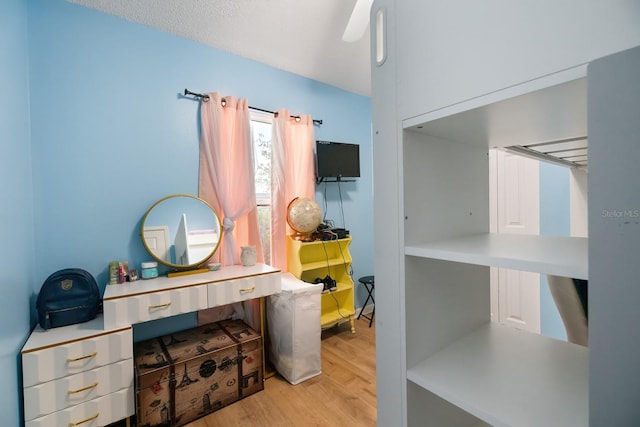 office area with light hardwood / wood-style flooring and built in desk