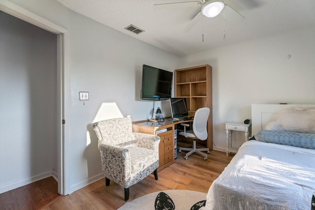 bedroom featuring wood-type flooring and ceiling fan