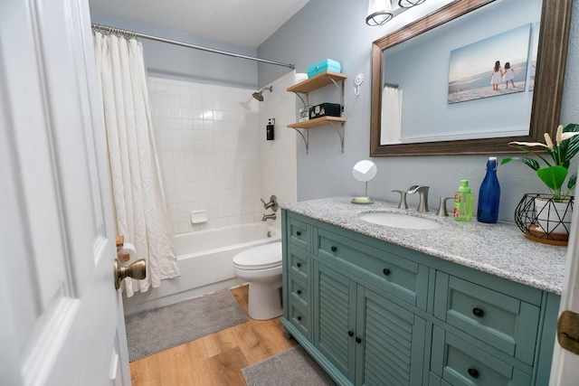 full bathroom featuring shower / bathtub combination with curtain, wood-type flooring, vanity, and toilet