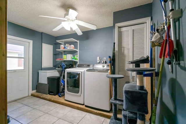 laundry room featuring ceiling fan, light tile patterned flooring, independent washer and dryer, and a textured ceiling