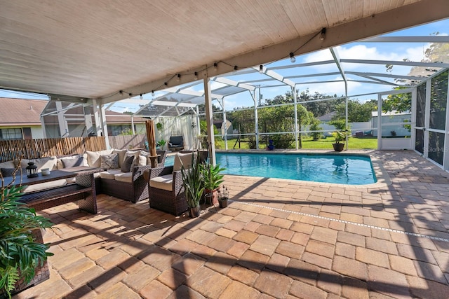 view of swimming pool with a lanai, a patio, and outdoor lounge area