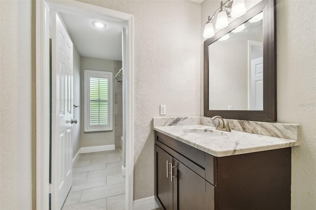 bathroom featuring vanity and tile patterned flooring