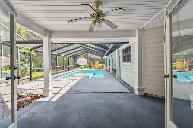 view of swimming pool with a lanai, a patio, and ceiling fan