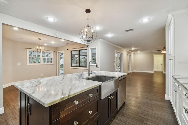 kitchen with sink, white cabinetry, hanging light fixtures, a center island with sink, and dark hardwood / wood-style flooring