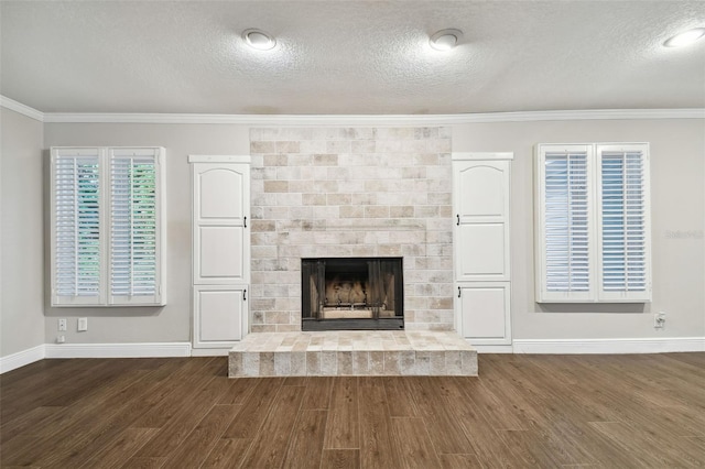 unfurnished living room with crown molding and dark hardwood / wood-style floors