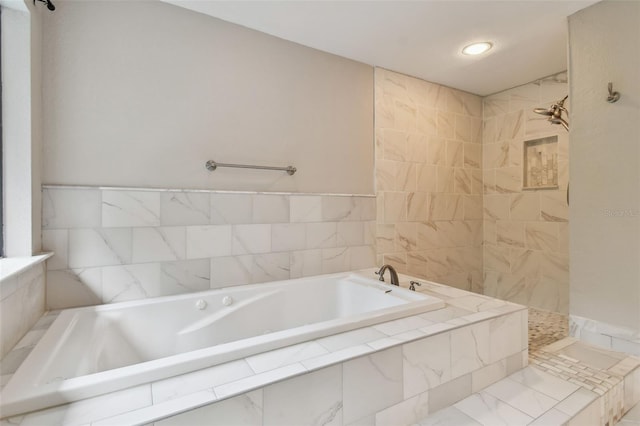 bathroom with shower with separate bathtub