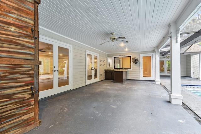 view of patio with french doors and ceiling fan