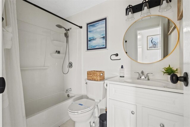 full bathroom featuring  shower combination, vanity, a textured ceiling, and toilet