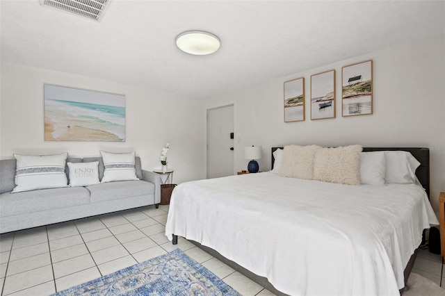 bedroom with light tile patterned floors