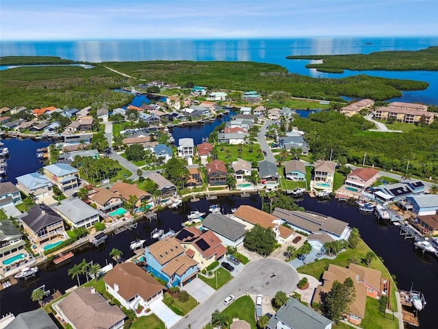 birds eye view of property featuring a water view