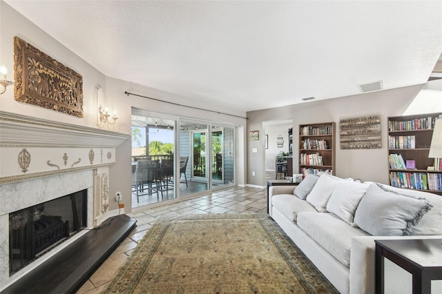 living room featuring a premium fireplace