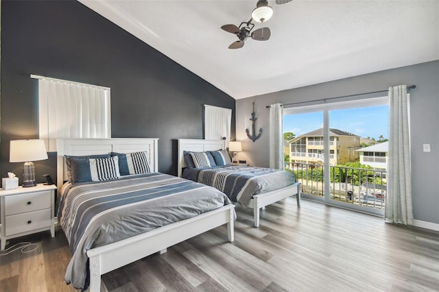 bedroom featuring lofted ceiling, ceiling fan, hardwood / wood-style floors, and access to outside