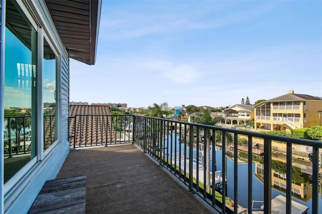 balcony featuring a water view