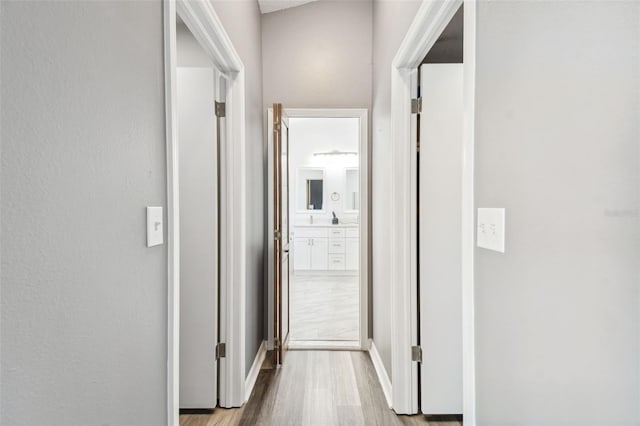 hallway featuring light hardwood / wood-style flooring