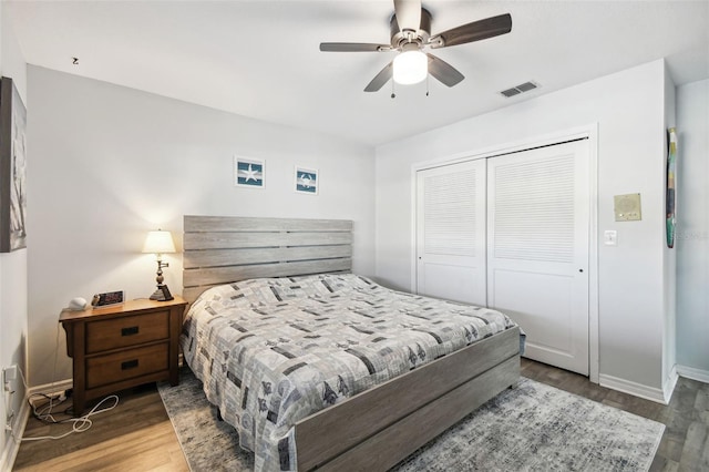 bedroom featuring a closet, wood-type flooring, and ceiling fan