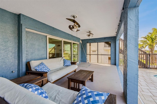 view of patio featuring an outdoor living space and ceiling fan