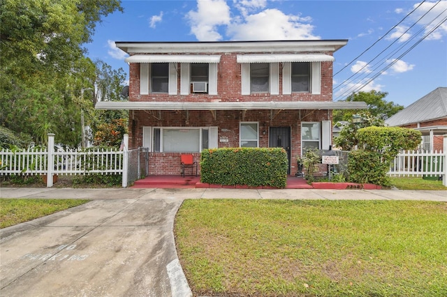 view of front of property with a front lawn and covered porch