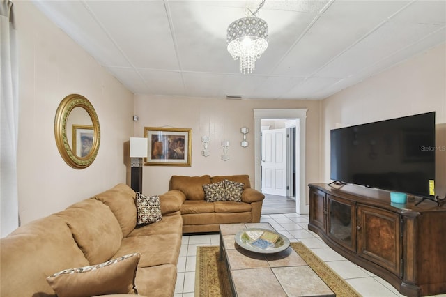 tiled living room with a chandelier