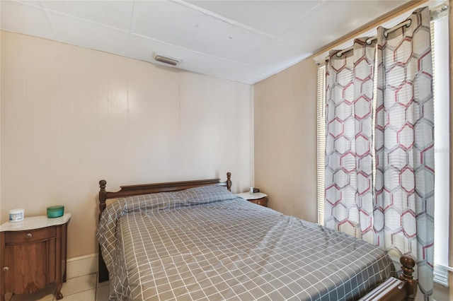 bedroom featuring visible vents and tile patterned floors