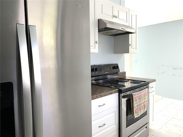 kitchen with white cabinets and appliances with stainless steel finishes