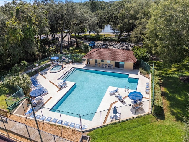 view of swimming pool with a lawn and a patio area