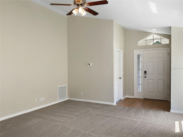 entryway with carpet floors, ceiling fan, and high vaulted ceiling