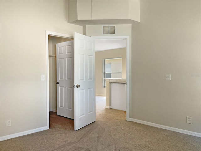 unfurnished bedroom with light carpet