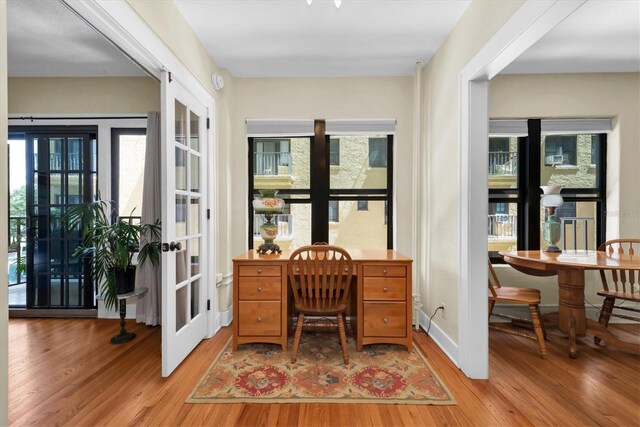 office area featuring light hardwood / wood-style floors and french doors