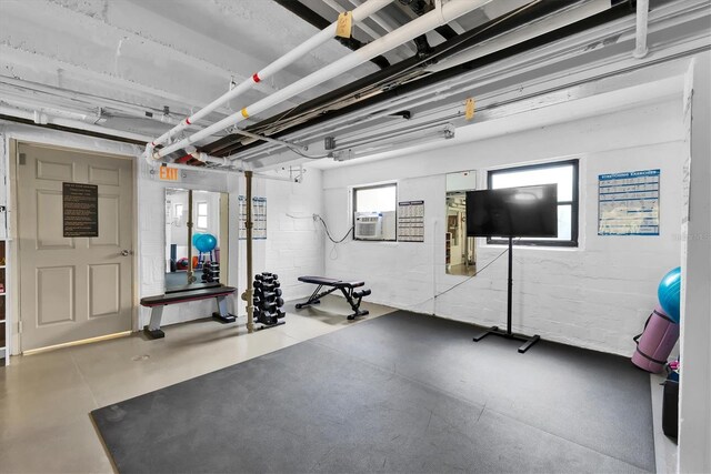 exercise area with concrete flooring and cooling unit