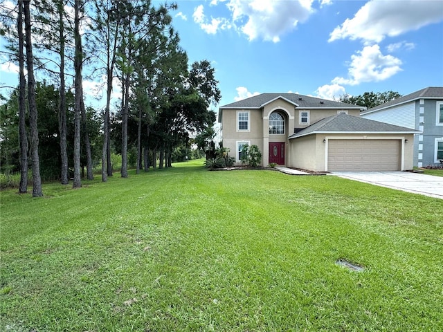 view of property featuring a garage and a front lawn