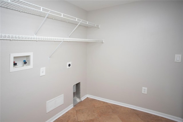 clothes washing area featuring hookup for a washing machine, baseboards, visible vents, hookup for an electric dryer, and laundry area