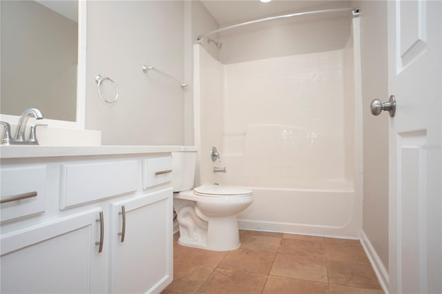 bathroom featuring tile patterned floors, tub / shower combination, toilet, and vanity