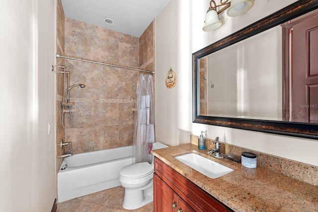 full bathroom featuring shower / bath combo with shower curtain, tile patterned flooring, vanity, and toilet