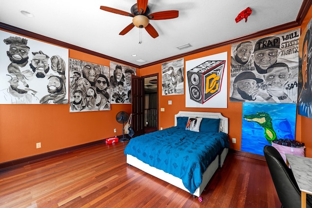 bedroom featuring wood-type flooring, crown molding, and ceiling fan