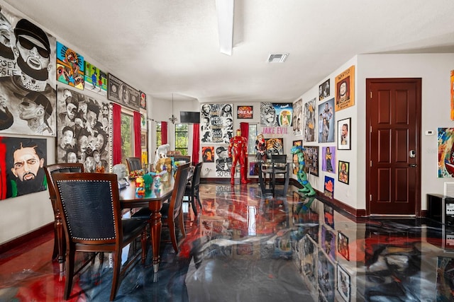 dining area featuring concrete floors