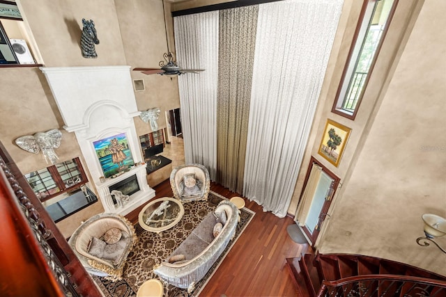 interior space featuring ceiling fan and dark hardwood / wood-style flooring