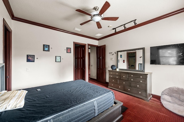 bedroom with dark carpet, ceiling fan, and crown molding