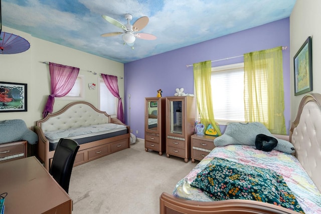 bedroom featuring light carpet and ceiling fan